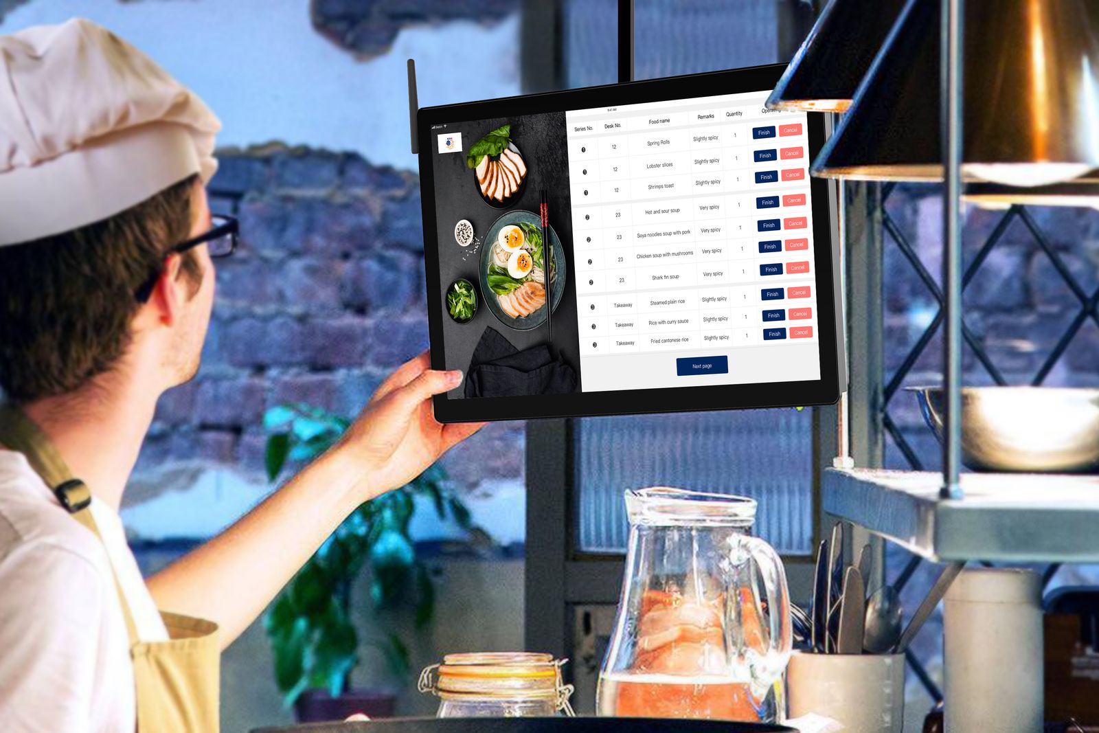 Chef reviewing kitchen orders on a digital tablet during service