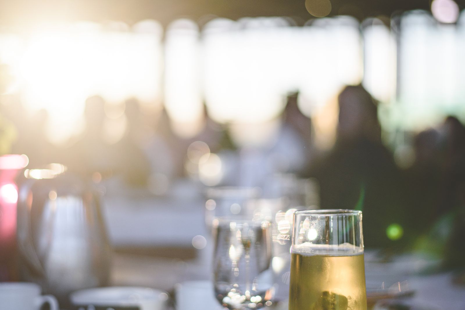 A sparkling aperitif on a restaurant table in warm early-evening light